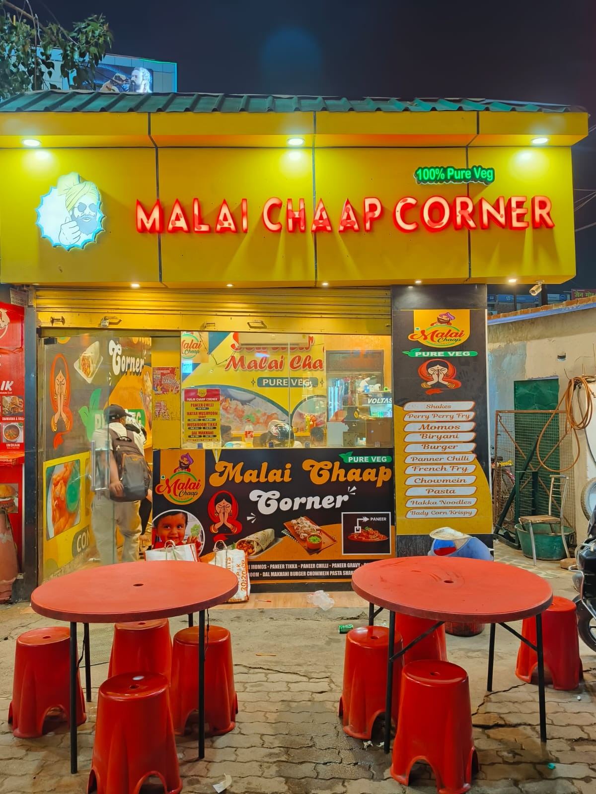 Malai Chaap Corner storefront lit up at night